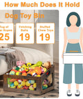 Wooden Dog Toy Basket With Slanted Front For Easy Reach filled with toy ropes, balls, and chew toys beside a couch