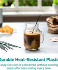 7 Inch Black Disposable Stir Sticks For Hot And Cold Beverages in glass jar with iced coffee on table