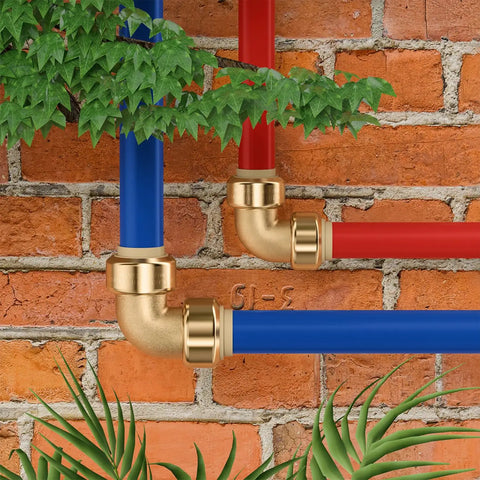 Three Quarter Inch Push Fit Elbow Fittings 12 Pack No Tools Needed Easy Quick Connect For Copper PEX CPVC Brass Plumbing Pipes 90 Degree Push To Connect Elbows Lead Free Brass Durable Home Repair Fittings connected to red and blue pipes against brick wall.