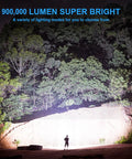 Rechargeable Spotlight 900,000 Lumens Handheld LED Flashlight illuminating a forest landscape at night.