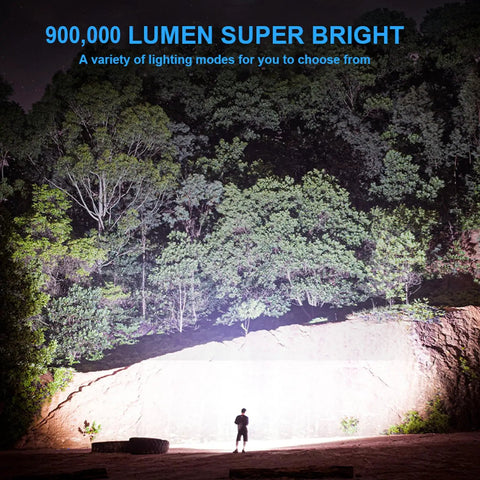 Rechargeable Spotlight 900,000 Lumens Handheld LED Flashlight illuminating a forest landscape at night.