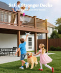 Children and dog playing in backyard with a wooden deck, highlighting safer, stronger deck stability.