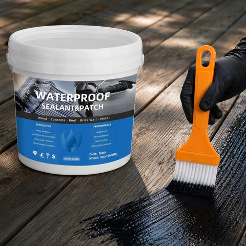Big Time Roof Saver Black Waterproof Rubber Sealant For Flat And Metal Roofs With Flexible Crack Bridge being brushed on wood surface.
