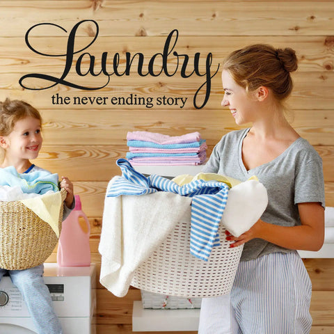 Woman and child with laundry baskets in front of "Laundry the never ending story" wall decal, black vinyl, home decor.
