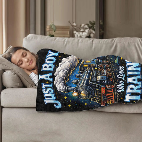Woman sleeping under a Steam Train Locomotive Lightweight Fleece Blanket Cozy As Heck Throw For Living Room Couch And Home Decor 50x60 Inches Gift For Women, Girls, Boys, And Adults with 'Just A Boy Who Loves Train' design.