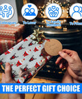 Person holding Christmas gift with Santa wrapping paper and Secret Santa tag, fireplace and gift boxes in background.