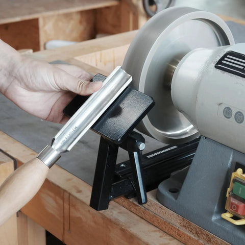 Total No Sweat Setup For Your Shop This Upgraded Grinding Jig System with a bowl gouge on a sturdy jig by an eight inch grinder.