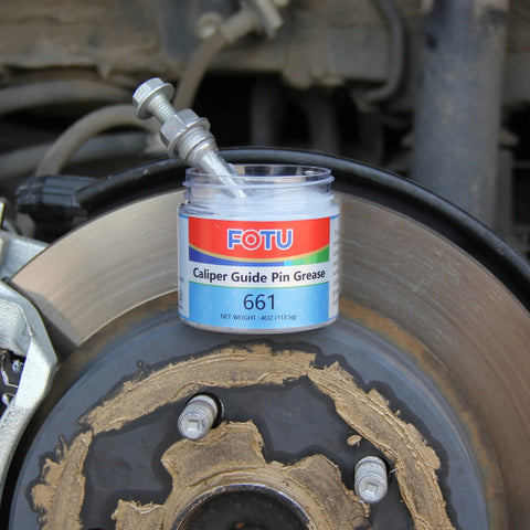 FOTU Caliper Guide Pin Grease jar, 4 oz, 661 label, placed on brake rotor next to caliper bolts