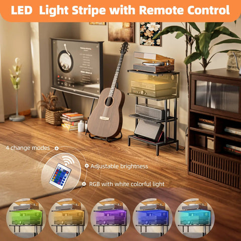 Four Tier Gaming Console Stand with Outlet and USB Ports, RGB Light Strips in a cozy media room, guitar and remote visible.