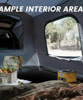 Interior view of Roomy Family SUV Tent For 5 To 9 People With 8ft L X 10.6ft W x 7.2ft H Center Height, featuring windows and space for camping gear.