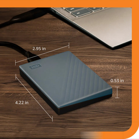 2TB Portable External Hard Drive With USB C And USB A For Windows Mac Chromebook Consoles And Mobile Devices Plug And Play Convenience next to laptop