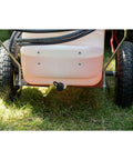 Rear view of Tow-Behind Garden Sprayer With 15 Gallon Tank, 30 Inch Boom, 1.6 GPM At 100 PSI on grass, focusing on wheels and tank outlet.
