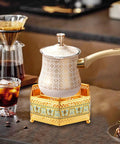 Turkish Warmer Coffee Pot With Tealight Warmer Base For Butter Chocolate Melting Kettle Stovetop Teapot 900ml shown on a countertop