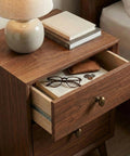 Open drawer with 2 Pack Antique Brass Cabinet Knobs For Dresser Drawers 1.3 Inch Oval Zinc Alloy Pulls, books and glasses on top.
