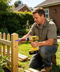Man using Versatile Carbon Steel Drill And Angle Grinder Converter Quick Release Attachment for fence assembly