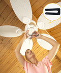 Person using Easy Peasy Ceiling Fan Blade Balancing Kit Three Pack With Plastic Clips And Nine Metal Self Adhesive Weights Fix Unbalanced Fans Fast