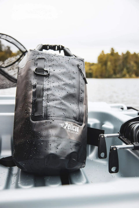 ExoDry 30L Large Drybag with Roll Top Closure Waterproof 500D PVC in black on kayak with water droplets, with backpack straps.