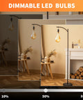 Dimmable LED Oversized Edison Bulbs With Amber Glass Finish in different brightness levels over a floor lamp in a cozy room setup.