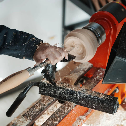 Heavy Duty Woodturning Hollowing Tool With Replaceable Carbide Tipped Round Blade And Solid Beech Handle in use on a lathe.