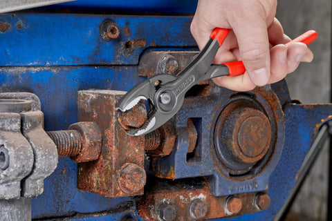 Using Slim Front And Side Grip Pliers With Box Joint And Push Button Adjustment For Tight Spots, 200 Mm on rusted bolt