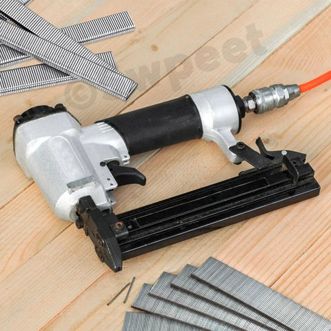 No Sweat 1609 Piece Pneumatic Staple And Nail Bundle Featuring 18 Gauge Narrow Crown Staples Plus 5/8 Inch Brad Nails With Rust Resistant Galvanized Finish And Sturdy Carry Case To Bang Out Any Home Project Or Construction Task - Pneumatic staple gun and galvanized staples on wooden surface.