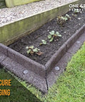 Heavy Duty 12 Inch Round Metal Landscape And Paver Edging Anchoring Spikes 10 Pack installed in garden edging