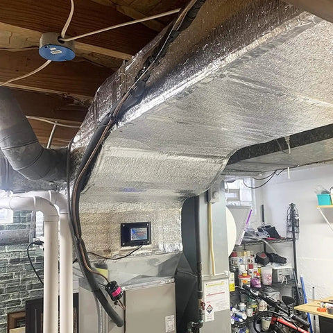 Badass Self Adhesive Aluminum Foil Insulation Roll With Heavy Duty Thermal Soundproof Foam installed on basement ductwork.