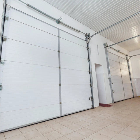 Heavy Duty Garage Door Torsion Spring Kit With Cables And Brackets installed on 7 ft tall doors in a garage