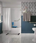 Modern bathroom with blue and white design, large window, tub with shower curtain, towel rack, and white fixtures.