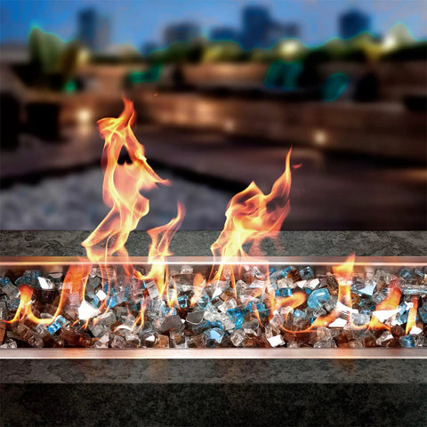 10 Pound Blended Reflective Fire Glass For Fire Pits And Fireplaces Half Inch Mixed Colored High Luster Rocks Aqua Blue Platinum Copper For Outdoor And Indoor Use in a linear fire pit.