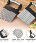 Two stainless steel crinkle cutters with black ergonomic handles and large wavy blades for fries and vegetables
