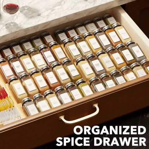 No Sweat Adjustable Bamboo Spice Drawer Organizer Expands To Fit Any Kitchen Cabinet Slot with neatly arranged spice jars.