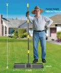 Heavy Duty Lawn Leveling Rake With Stainless Steel Handle 72 Inch Yard Leveling Tool on grass, man standing nearby
