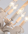 Close-up of white French country five-light chandelier with antique distressed wood cozy farmhouse rustic pendant light.