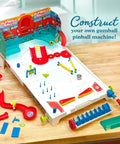 Build Your Own Pinball Machine STEM Kit For Kids And Makers, Gumball Rally Edition on a wooden table with reconfigurable parts