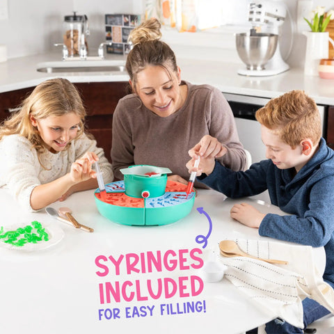 Family using Ultimate Gummy Candy Making Kit For Home Use With Four Mold Shapes And Heating Base, syringes for filling.