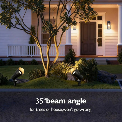 Low Voltage LED Landscape Spotlights 12V Garden Lights With Connectors 7.5W 3000K Warm White Outdoor Lights For House Waterproof Yard Light For Trees And Pathways 4 Pack Easy Install Durable Weatherproof lighting up a tree in front of a house with a 35-degree beam angle.