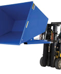 Built Like A Tank Steel Self Dumping Hopper With 6000 Lb Capacity and Three Cubic Yards for Loading Dry Bulk Materials Forklift Compatible Blue Bin in use.