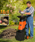 Man using Powerful 15 Amp Electric Wood Chipper Shredder With 1.75 Inch Cutting Capacity For Branches And Twigs