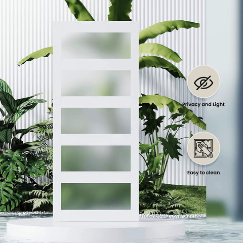 Double Bypass Barn Door With Frosted Glass And White Waterproof PVC Finish Includes Six Point Six Feet Track Hardware Kit Premium MDF Panels For Space Saving And Easy Assembly Fits Thirty Six By Eighty Four Inch Openings in a garden setting