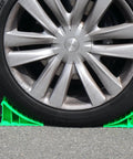 Heavy Duty Wheel Chocks Built Tough To Lock Your Rig Down Non Slip Safety Blocks For Rvs Trucks Trailers Campers Cars And Boats High Density Polypropylene Pair supporting a car tire on pavement.