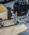 Beefy Dual-Mode Plunge Router 3-1/4 HP With 1/2 Inch Collet, Variable Speed in use on wood surface