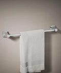 Riff 24 Inch Towel Bar Polished Chrome Built To Last Durable Zinc Construction with towel hanging in modern bathroom