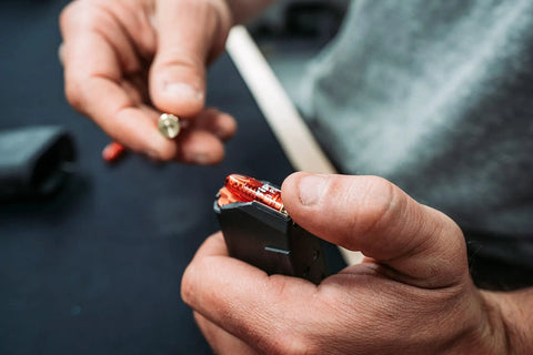 Loading 9mm Pistol Snap Caps Reusable Dummy Rounds for Safe Dry Fire into magazine