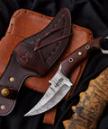 Handmade Damascus Steel Curved Fixed Blade Hunting Knife Nine Inch With Wooden Handle Ring Pommel Leather Sheath The Go To Tool For Camping And Outdoor Adventures Gift displayed with sheath