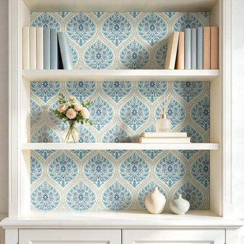 Vintage Blue Floral Damask Peel And Stick Wallpaper For Kitchen Cabinets, displayed on shelves with books and decor.