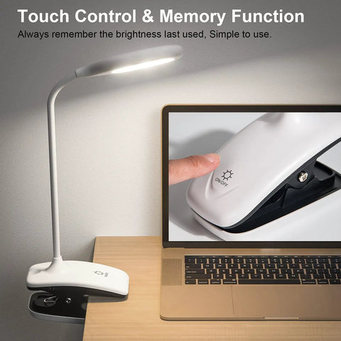 Clip On LED Desk Lamp With Battery Power Cordless Bedside Light Flexible Arm Eye Caring Memory Touch 3 Color Modes And Stepless Brightness Portable Reading Light For Study And Work next to laptop showcasing touch control feature.
