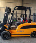 Smooth Operator Electric Forklift Powered By Hydraulic Lifting Mast And Wide Safety Arch in warehouse setting with ergonomic design.