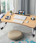 Foldable Laptop Desk For Bed Or Couch in use with laptop, keyboard, and tablet on it, showing sturdy lightweight design and drawer
