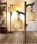68 Inch Farmhouse Floor Lamp With Tree Trunk Faux Wood Column Dark Bronze Wicker Drum Shade Rustic Country Cottage Decor For Living Room Bedroom Reading Nook Cozy Vibe, featuring wicker shade and tree branch detail.